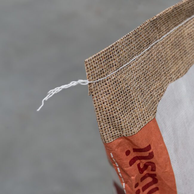 Bag with sewn closure